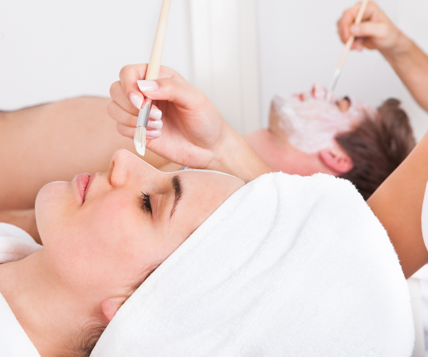 Man and woman having a Face treatment